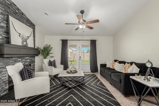 a living room with furniture and a fireplace