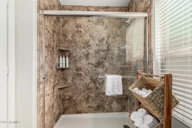 a bathroom with a shower curtain and a sink