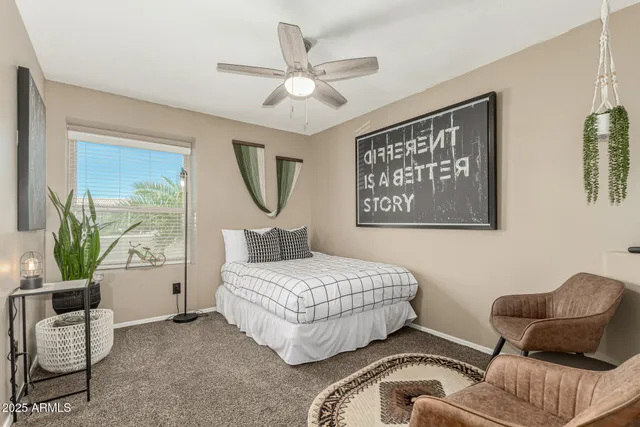 a bedroom with a bed and a couch