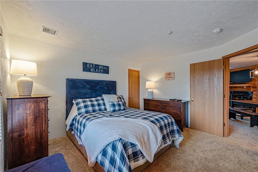 F7 Sunridge Road Champion, PA 15622 - Photo 15 of 25 a bedroom with a bed and a book shelf