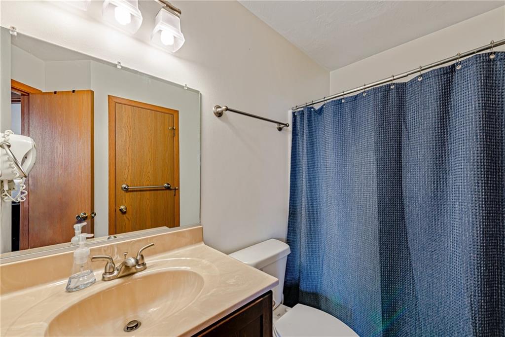 F7 Sunridge Road Champion, PA 15622 - Photo 16 of 25 a bathroom with a sink and a mirror