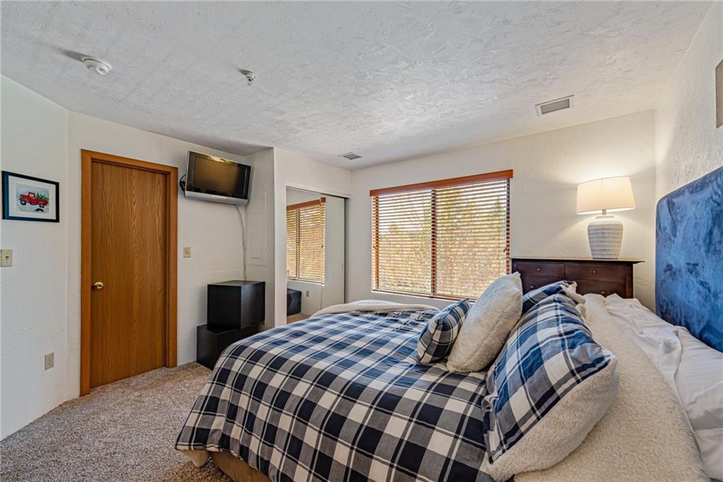 F7 Sunridge Road Champion, PA 15622 - Photo 17 of 25 a bedroom with a large bed and a window