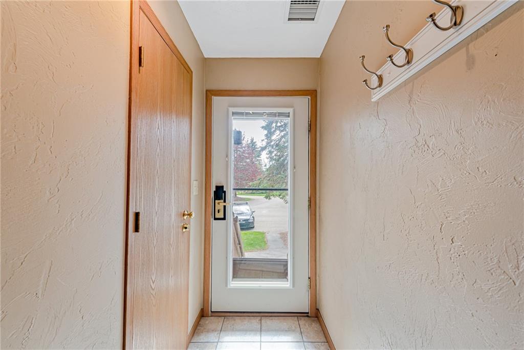F7 Sunridge Road Champion, PA 15622 - Photo 22 of 25 a view of a hallway with wooden floor and a dining room