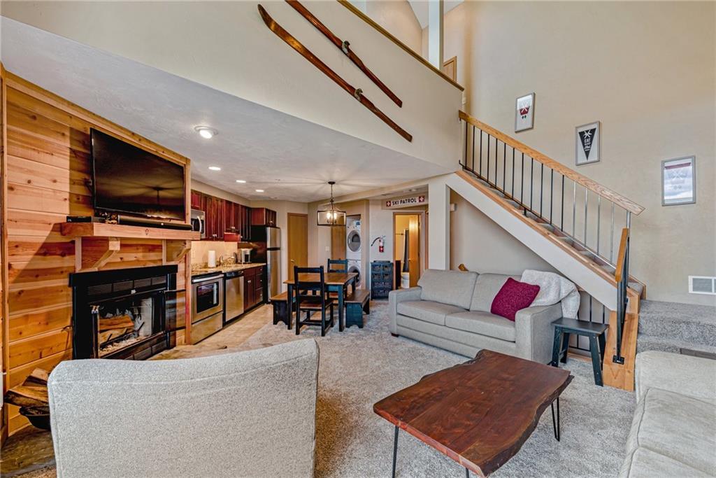 F7 Sunridge Road Champion, PA 15622 - Photo 5 of 25 a living room with furniture a flat screen tv and a fireplace