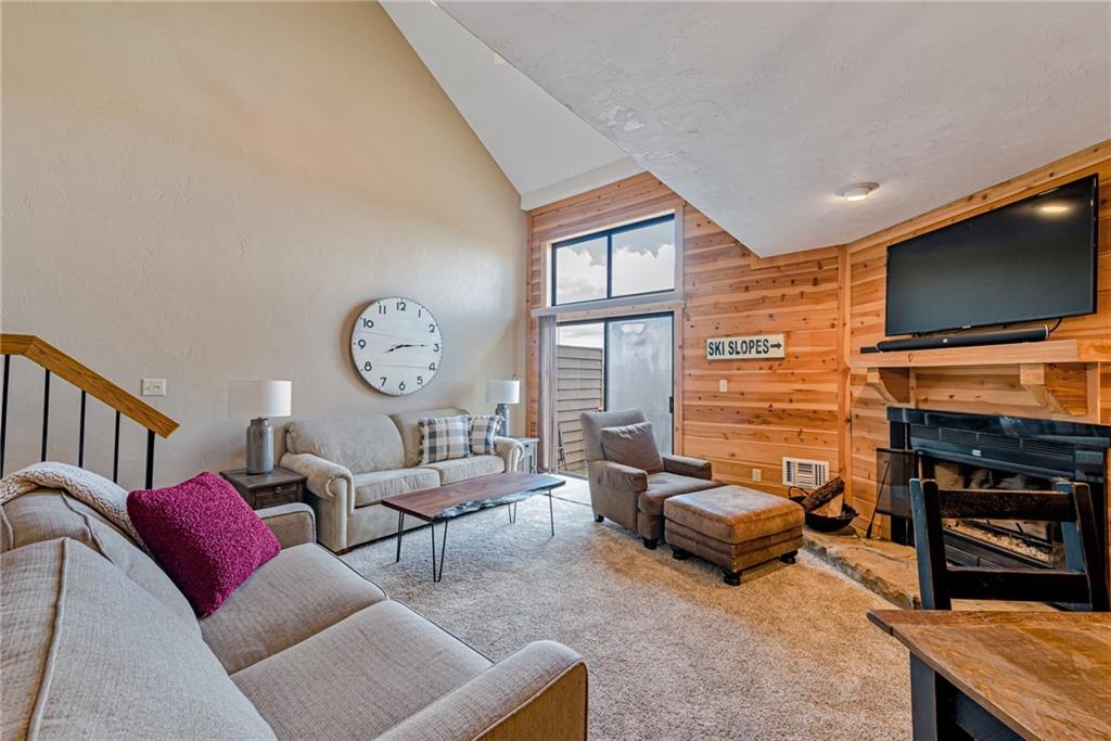 F7 Sunridge Road Champion, PA 15622 - Photo 6 of 25 a living room with fireplace furniture and a flat screen tv