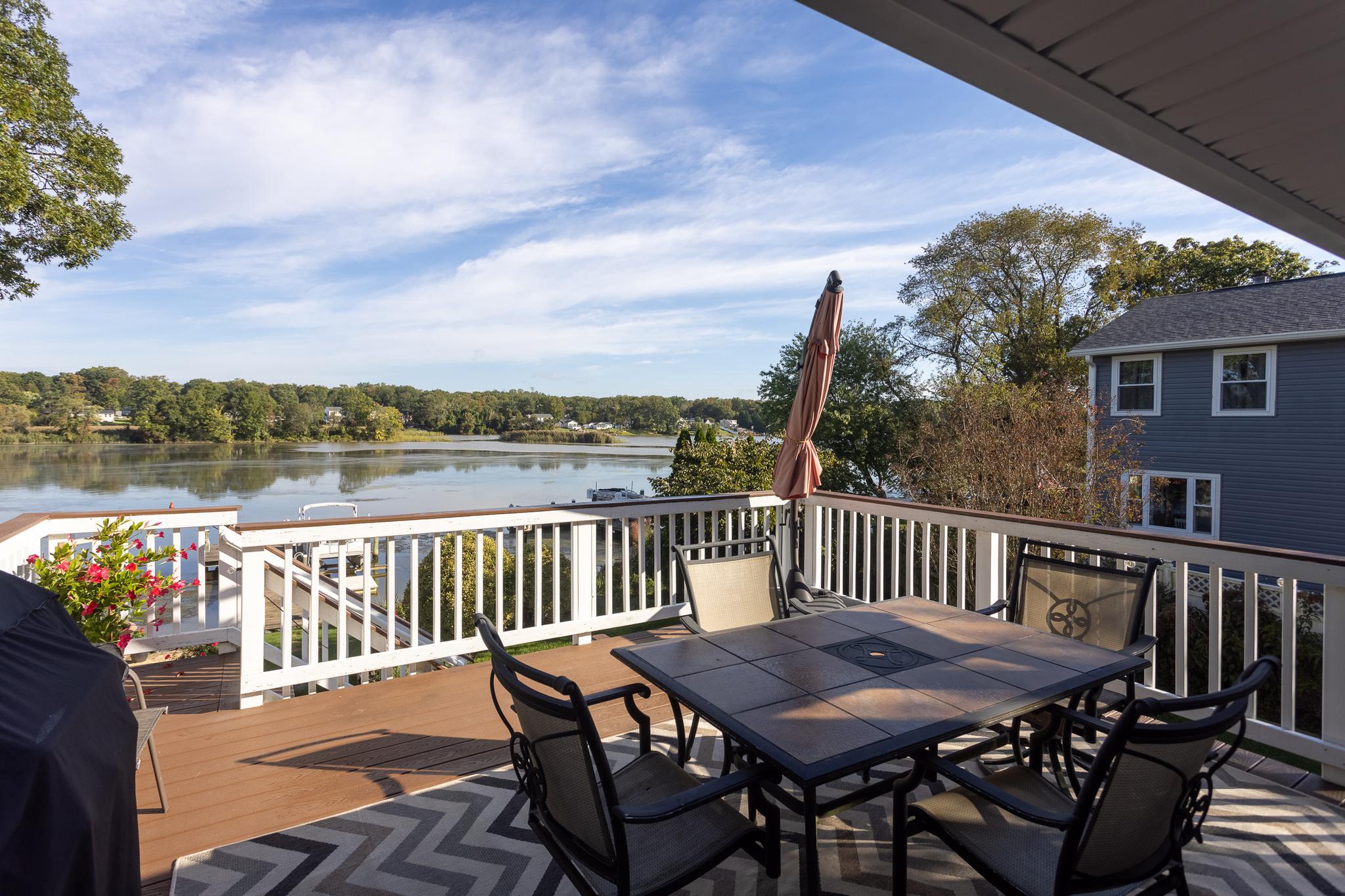 11104 Bird River Grove Road White Marsh, MD 21162 - Photo 12 of 48 a roof deck with chairs and wooden floor