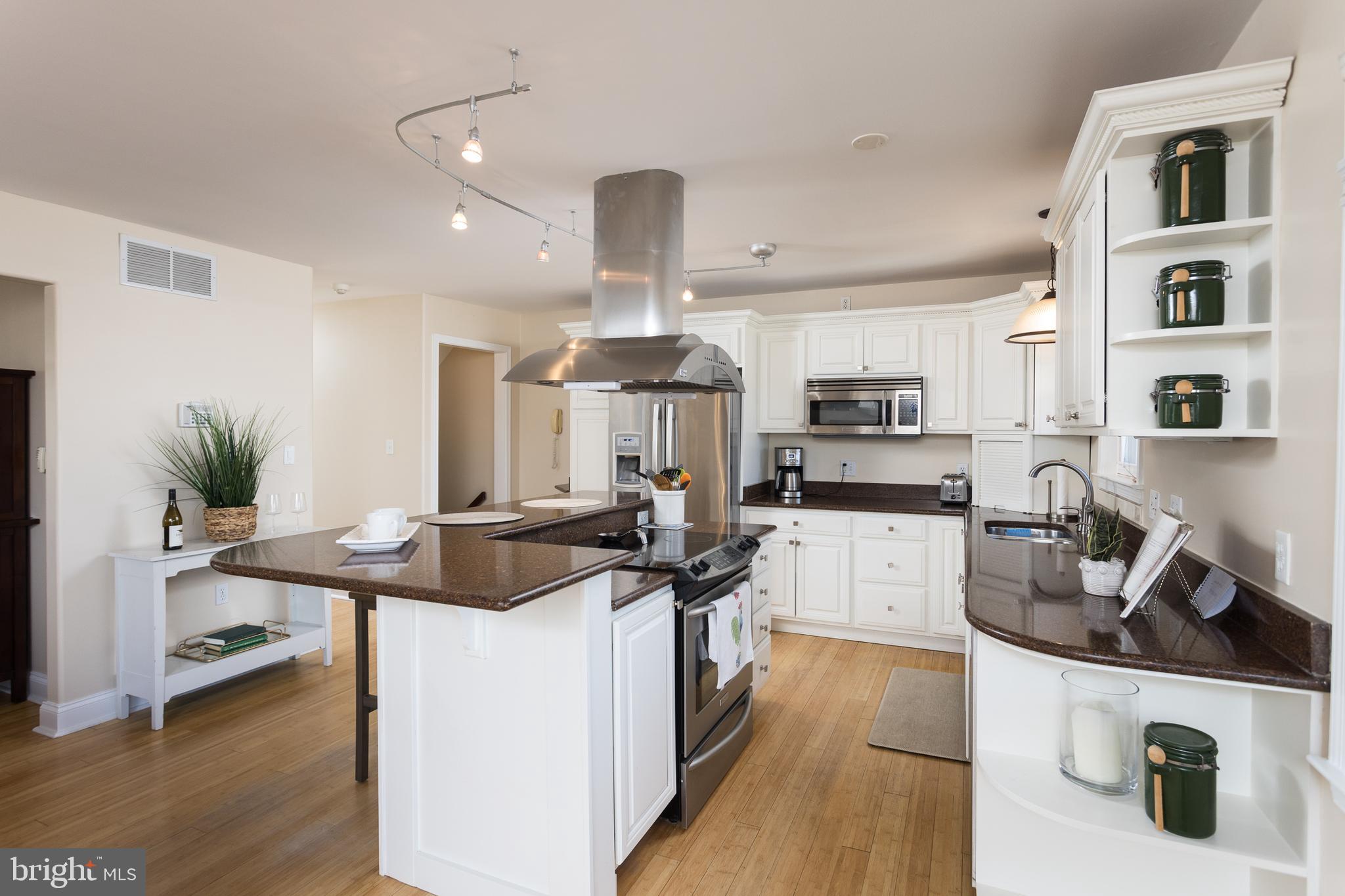 11104 Bird River Grove Road White Marsh, MD 21162 - Photo 13 of 48 a kitchen with stainless steel appliances granite countertop a sink and cabinets