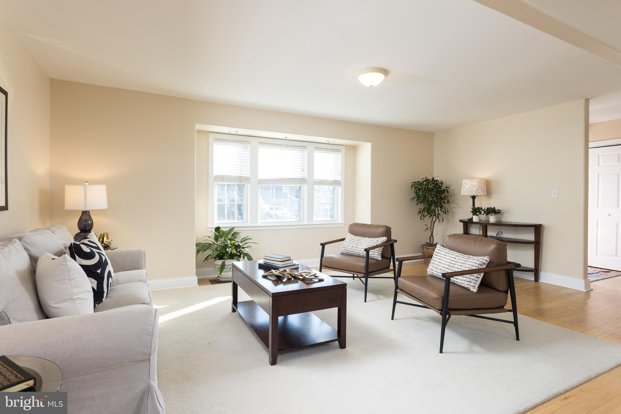 11104 Bird River Grove Road White Marsh, MD 21162 - Photo 16 of 48 a living room with furniture and a potted plant
