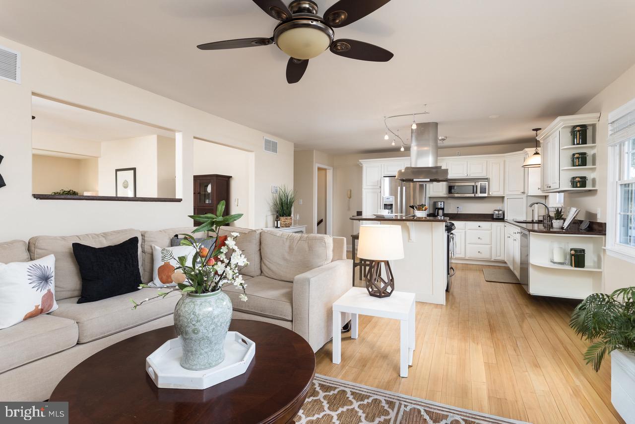 11104 Bird River Grove Road White Marsh, MD 21162 - Photo 16 of 48 a living room with stainless steel appliances kitchen island granite countertop furniture and a kitchen view