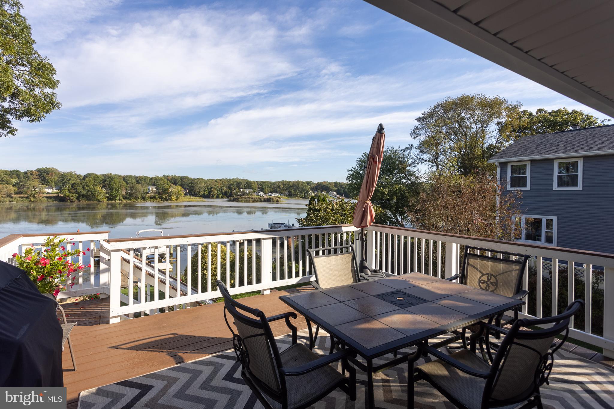 11104 Bird River Grove Road White Marsh, MD 21162 - Photo 17 of 48 a roof deck with chairs and wooden floor
