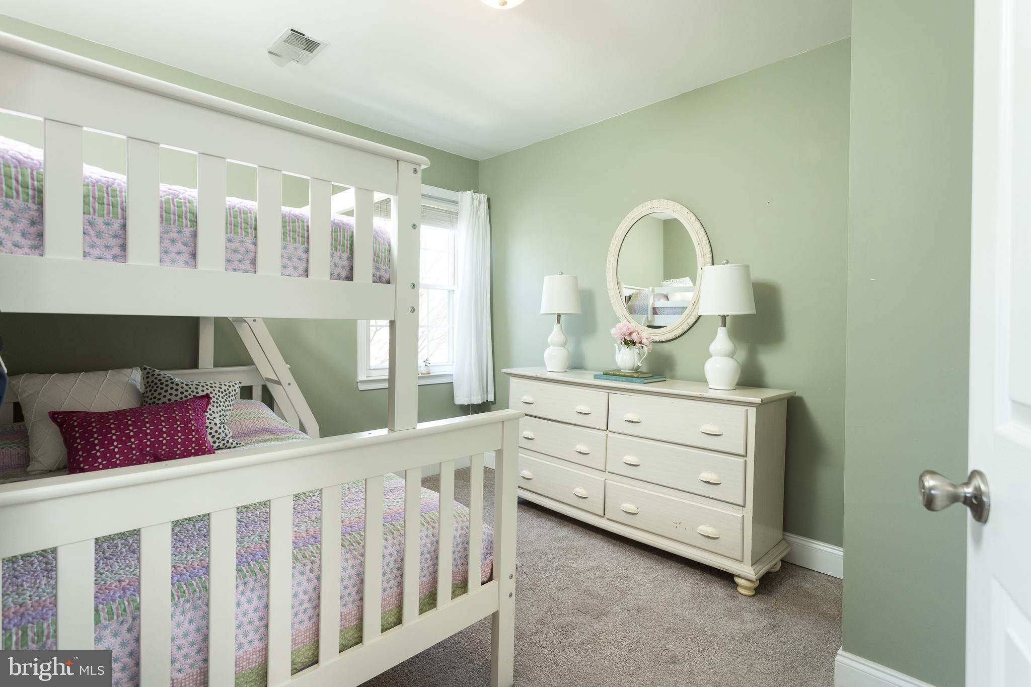 11104 Bird River Grove Road White Marsh, MD 21162 - Photo 19 of 48 a bedroom with a bed and a baby crib