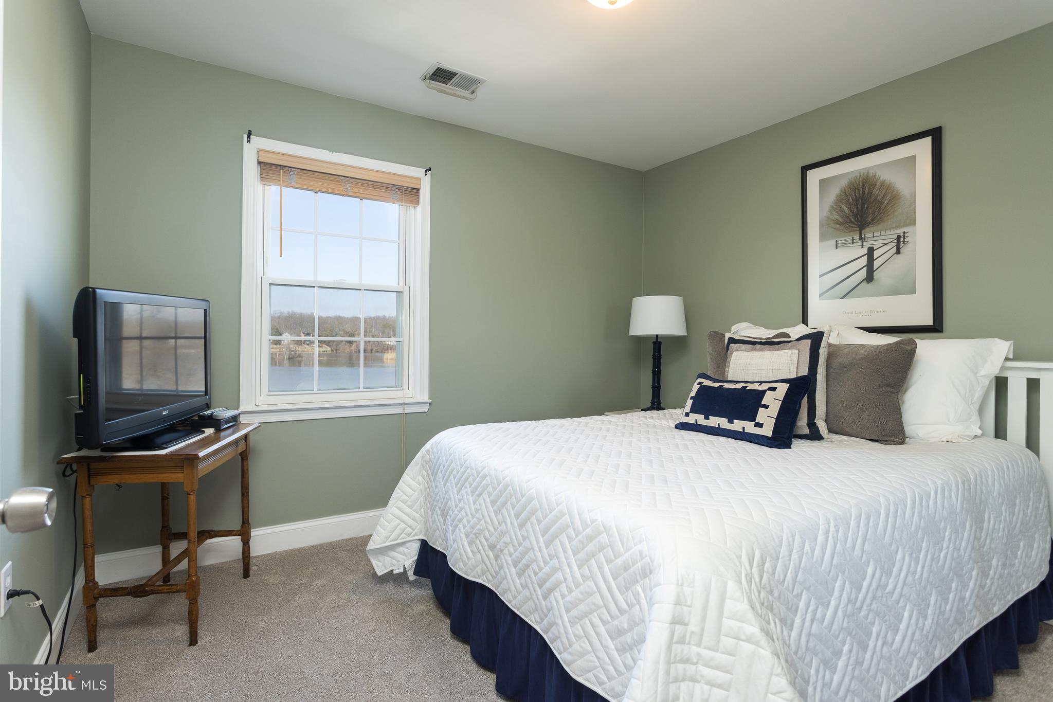 11104 Bird River Grove Road White Marsh, MD 21162 - Photo 20 of 48 a bedroom with a bed and a desk