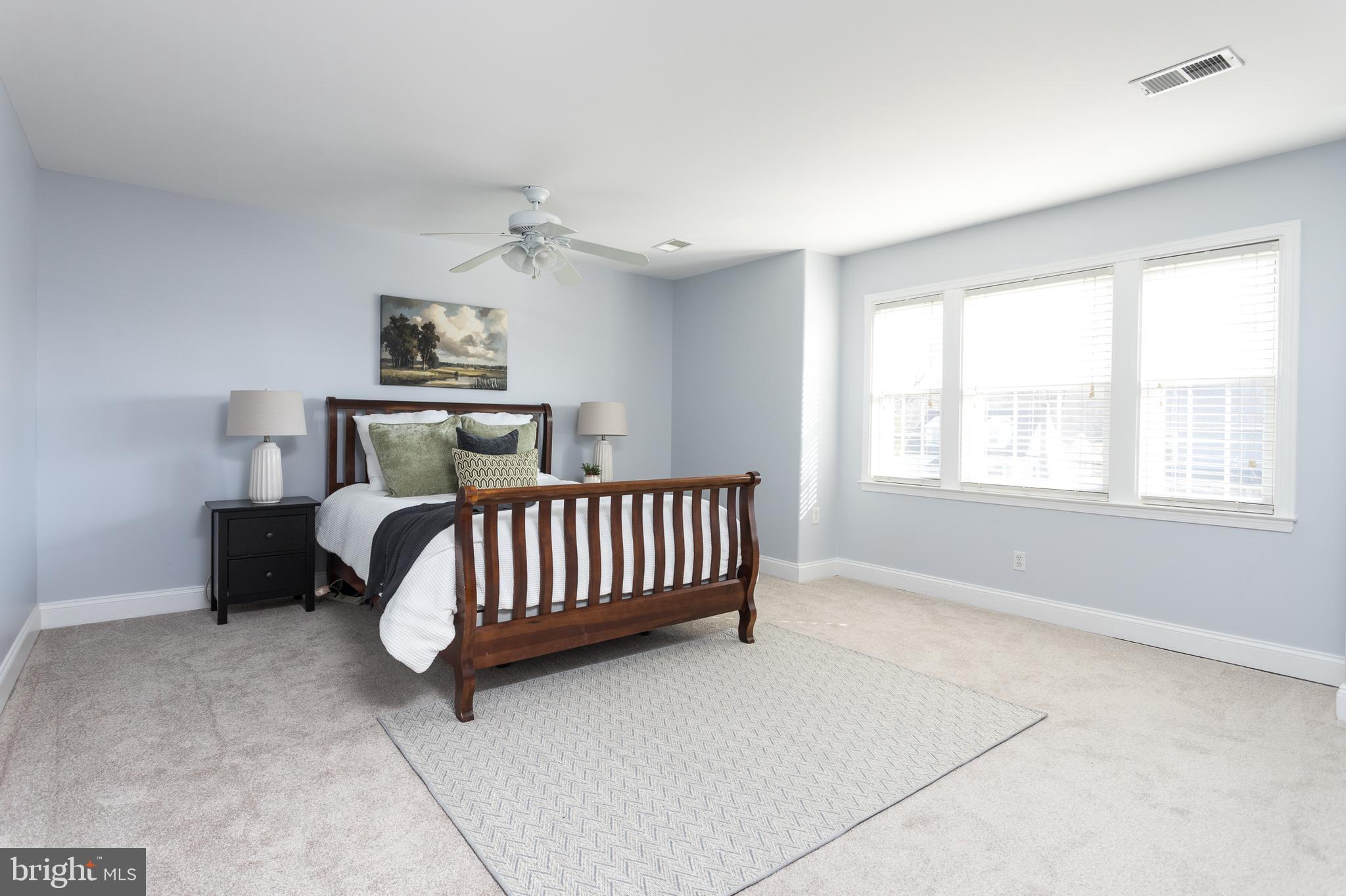 11104 Bird River Grove Road White Marsh, MD 21162 - Photo 23 of 48 a bedroom with a bed and a couch