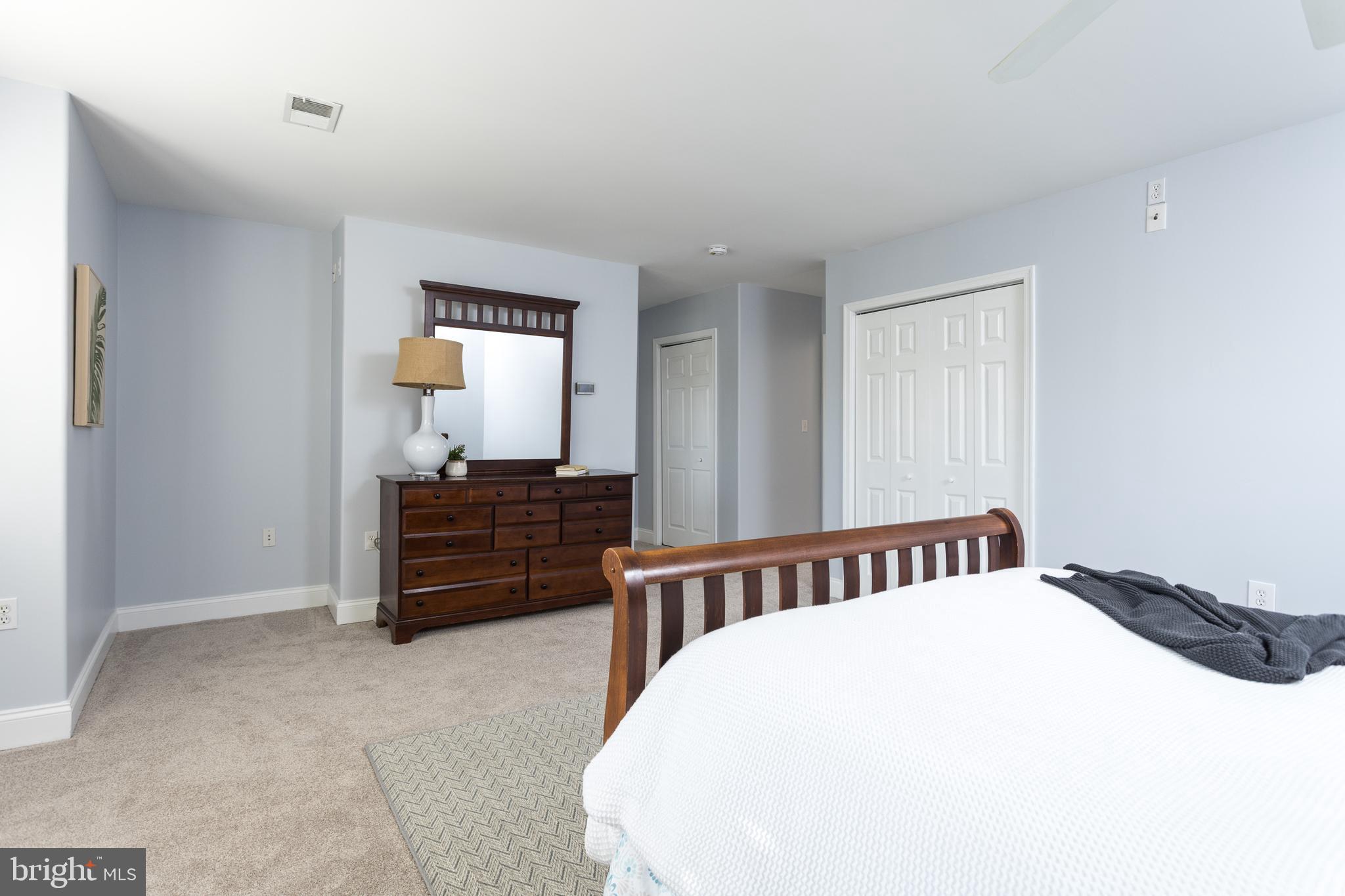 11104 Bird River Grove Road White Marsh, MD 21162 - Photo 24 of 48 a bedroom with a bed and wooden floor