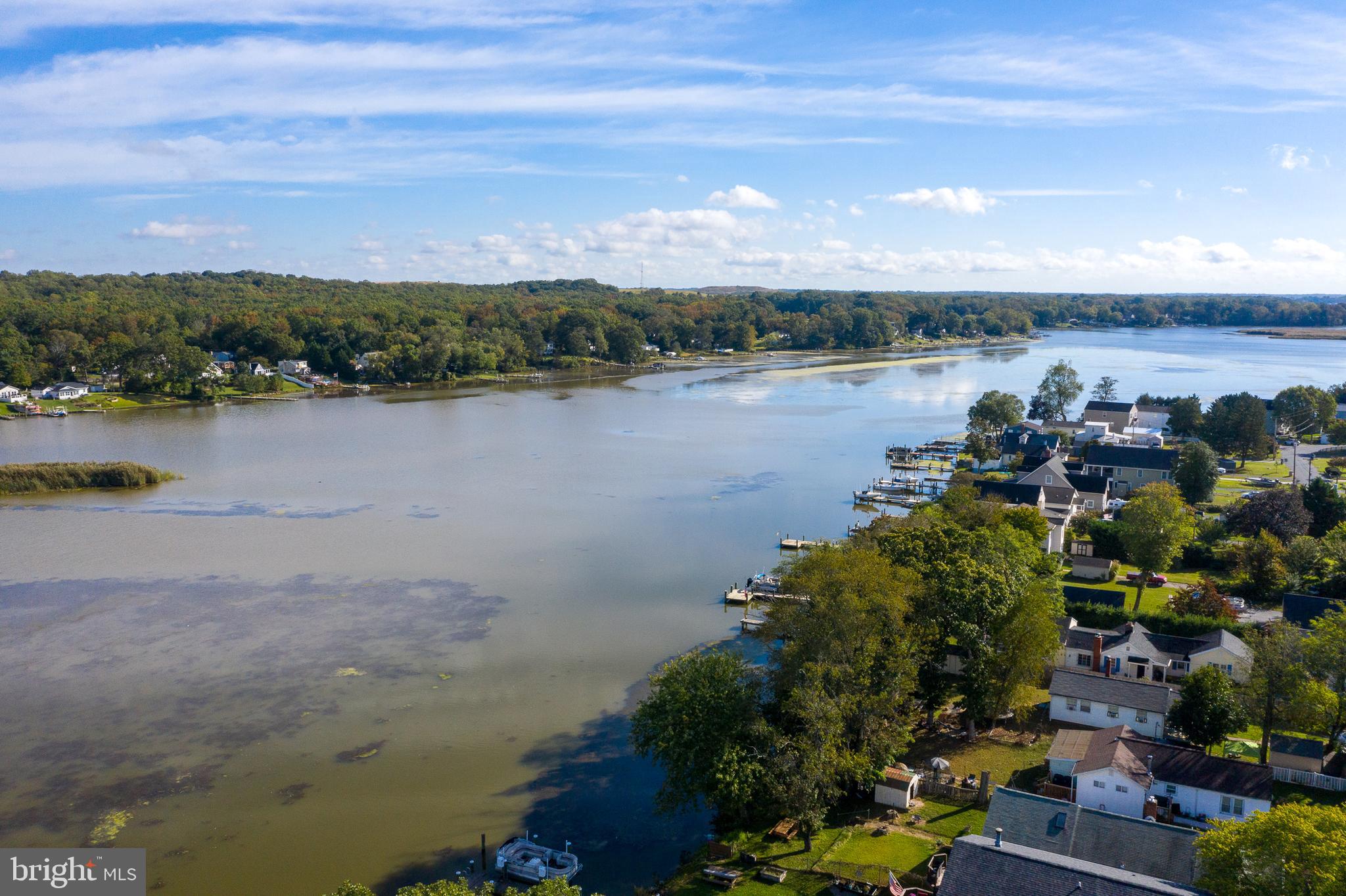 11104 Bird River Grove Road White Marsh, MD 21162 - Photo 40 of 48 a view of a lake with houses in the back