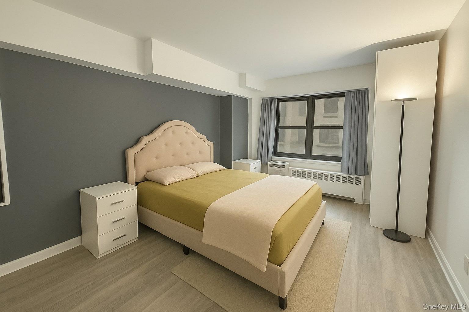 109-33 71st Road, Unit 7G Queens, NY 11375 - Photo 3 of 6 a spacious bedroom with a bed and a large window