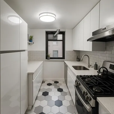 a kitchen with a stove a refrigerator and a sink