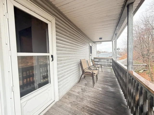 a view of a balcony with chairs