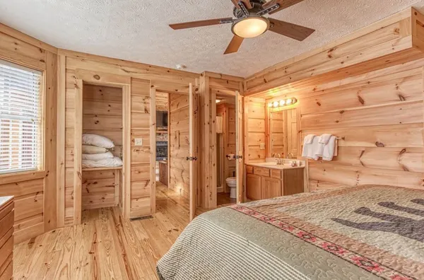 a bedroom with furniture and windows