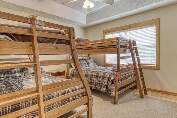 a bedroom with a bed and a television