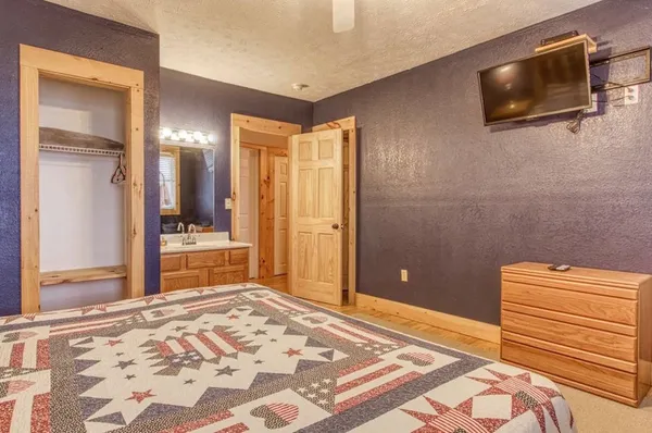 a room with pool table and windows