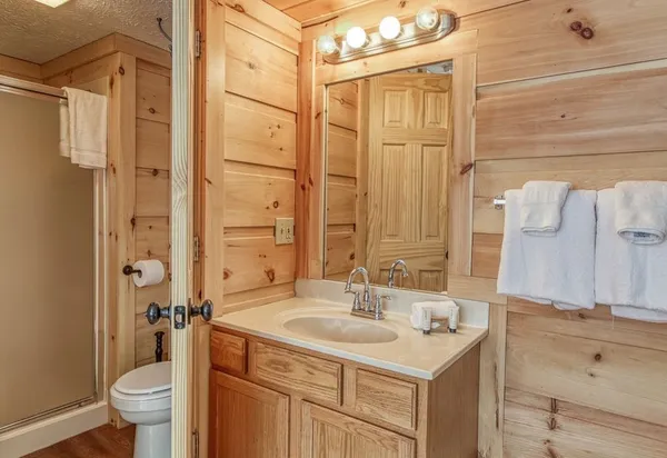 a bathroom with a sink double vanity and a shower