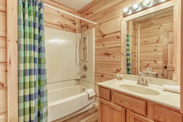 a bathroom with a tub and shower