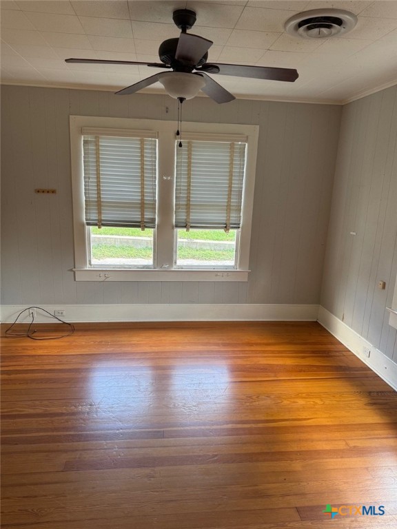 606 West Forrest Street Victoria, TX 77901 - Photo 9 of 15 a view of empty room with wooden floor and fan