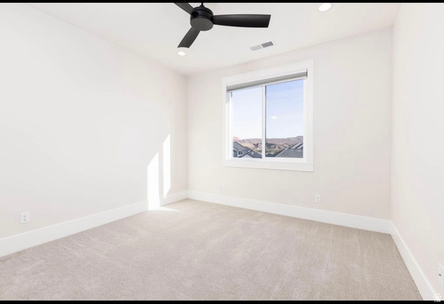 2788 East Rill Drive Washington, UT 84780 - Photo 26 of 41 Neutral-toned carpeting paired with white walls, baseboards, and window trim