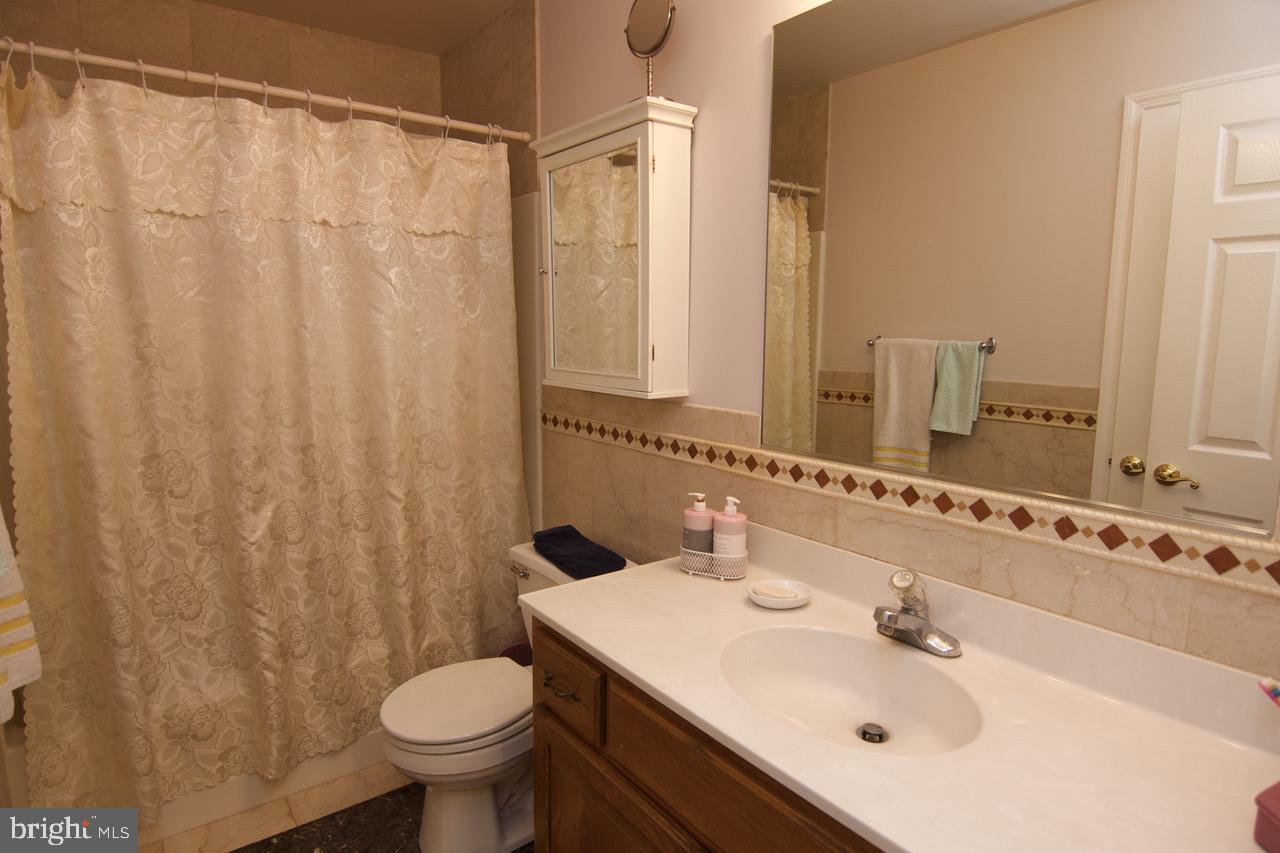 4421 Green Tree Road Reading, PA 19606 - Photo 18 of 28 Hall Bath w/ tile Floor & Backsplash