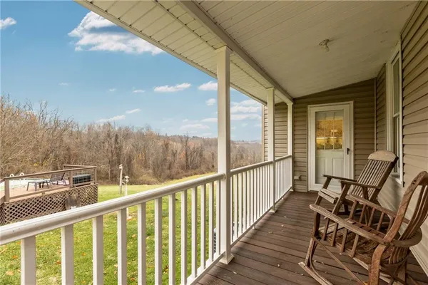 a view of balcony with furniture