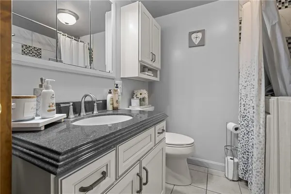 a kitchen with stainless steel appliances a sink and cabinets