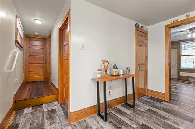 a view of entryway with wooden floor