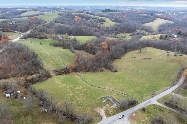 a view of a swimming pool with a yard