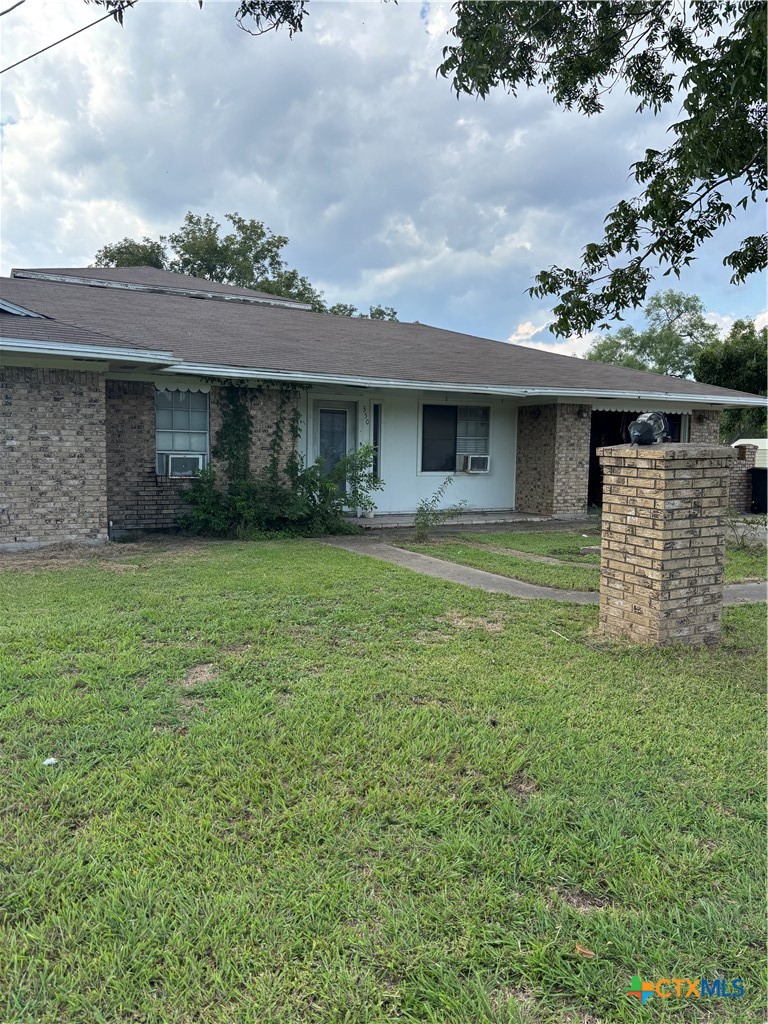 350 Grand Street Placedo, TX 77977 - Photo 3 of 15 a view of a house with a garden and yard