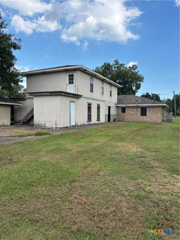 350 Grand Street Placedo, TX 77977 - Photo 7 of 16 a view of a house with a yard and sitting area