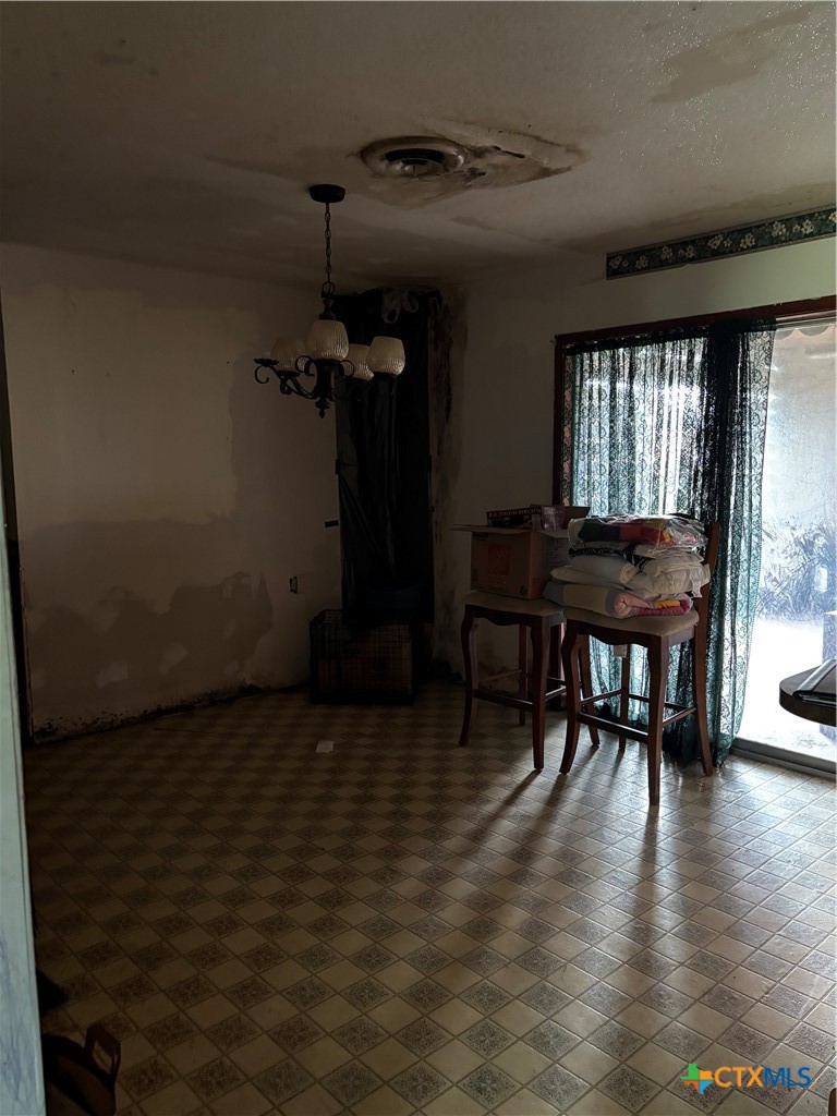 350 Grand Street Placedo, TX 77977 - Photo 9 of 15 a view of a dining room with furniture window and wooden floor