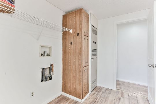 3727 Swallow Avenue Ridgecrest, CA 93555 - Photo 13 of 25 a view of a hallway with wooden floor and closet