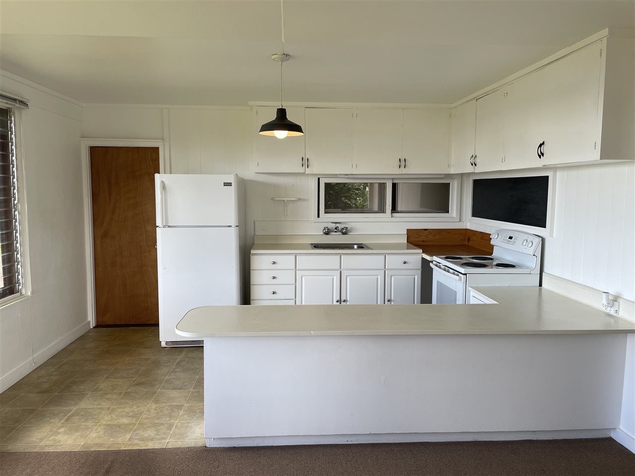 507 Lower Kimo Drive Kula, HI 96790 - Photo 2 of 30 a living room with stainless steel appliances kitchen island a white counter top space cabinets and a kitchen view