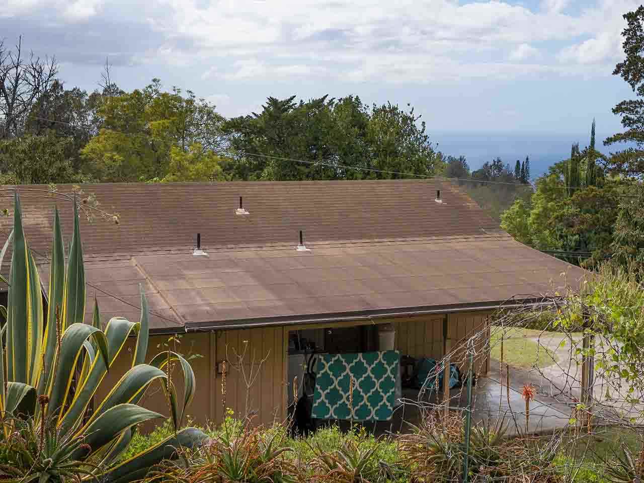 507 Lower Kimo Drive Kula, HI 96790 - Photo 27 of 30 a terrace with outdoor seating and trees