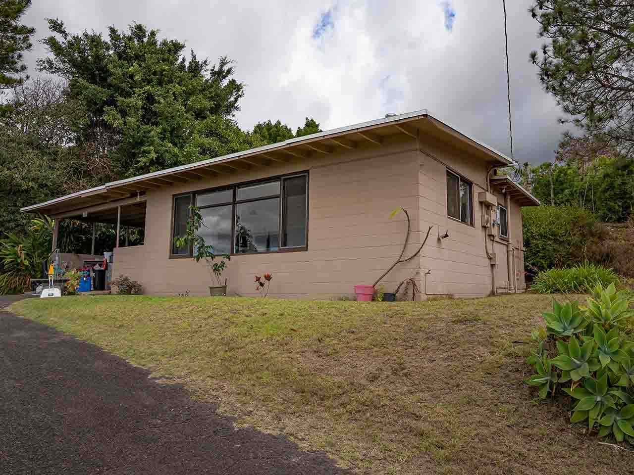 507 Lower Kimo Drive Kula, HI 96790 - Photo 9 of 30 a front view of a house with a yard and garage