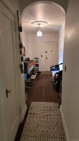 a view of a livingroom with hardwood floor and a ceiling fan