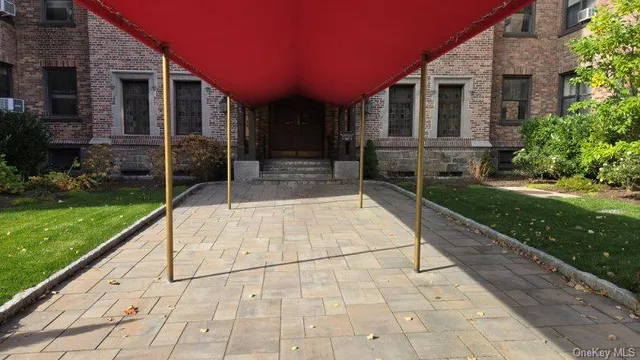 a view of a house with backyard and porch