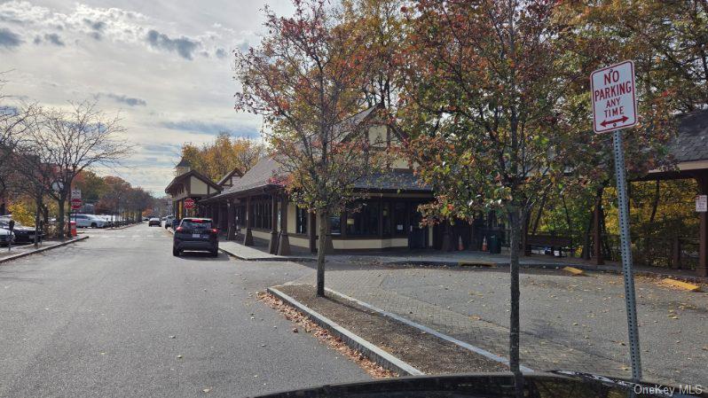 143 Garth Road, Unit 1J Scarsdale, NY 10583 - Photo 23 of 24 a view of a road with a building