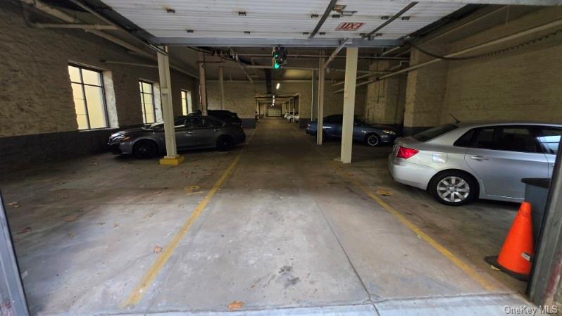 143 Garth Road, Unit 1J Scarsdale, NY 10583 - Photo 24 of 24 a view of a car garage