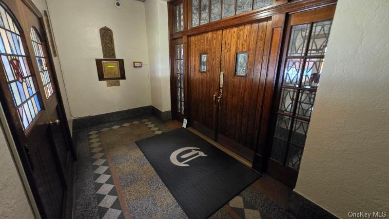 143 Garth Road, Unit 1J Scarsdale, NY 10583 - Photo 3 of 24 a view of an entryway