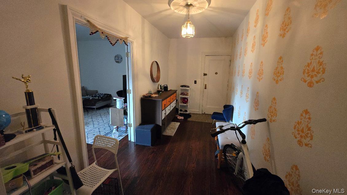 143 Garth Road, Unit 1J Scarsdale, NY 10583 - Photo 6 of 24 a view of a room with gym equipment