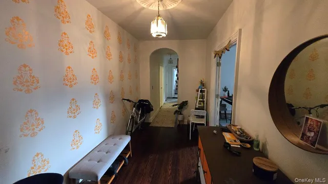 a view of a livingroom with furniture hardwood floor and a ceiling fan