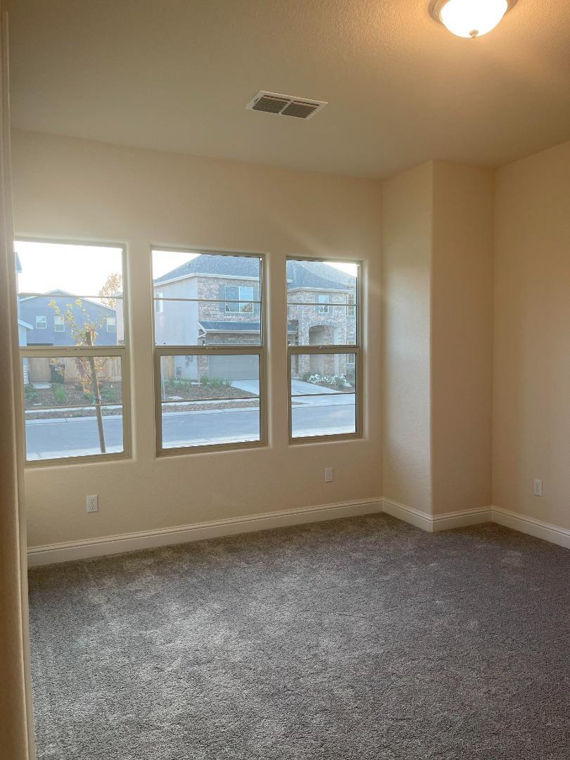 2411 Gabriel Drive Merced, CA 95340 - Photo 17 of 22 an empty room with windows
