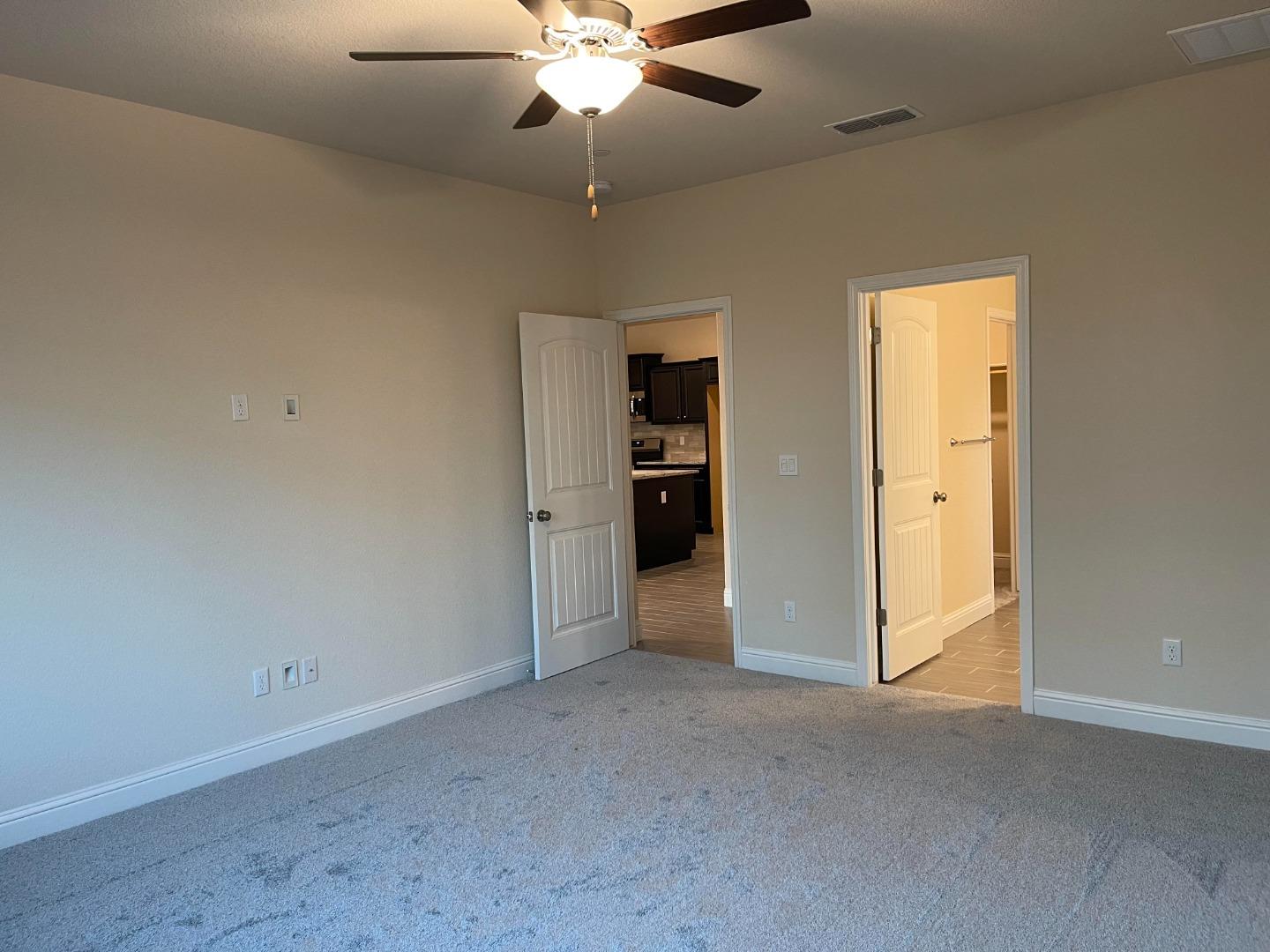2411 Gabriel Drive Merced, CA 95340 - Photo 22 of 22 an empty room with closet and a ceiling fan
